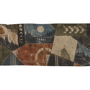 May include: A rectangular woven tapestry featuring a patchwork design of various illustrations including a compass, moon phases, a bridge over water, topographic lines, and geometric patterns in shades of rust, olive green, navy, and cream.