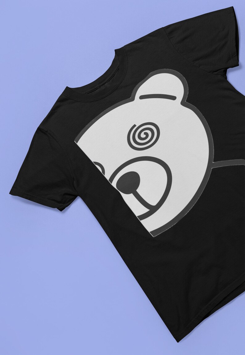May include: Black t-shirt with a white bear face graphic. The bear has a spiral design in one eye.