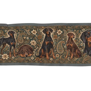 May include: A rectangular woven tapestry runner featuring a repeating pattern of Doberman dogs in various poses, including standing, sitting, and lying down, set against a dark background with intricate floral and paisley motifs in gold and green.