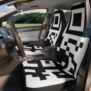 May include: Black and white car seat covers with a geometric pattern. The covers are made of a soft, comfortable fabric and are easy to install.