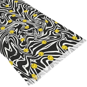 May include: Black and white swirl pattern with yellow smiley faces. The pattern is reminiscent of a psychedelic design.