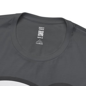 May include: A dark gray t-shirt with a white tag that says "Brain Wash" and has a QR code. The tag also says "Only" and "100% Cotton Made in Bangladesh" and has a size label that says "L".