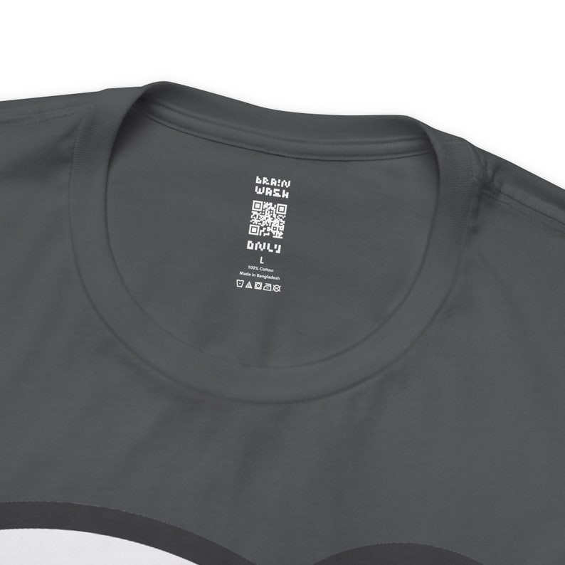 May include: A dark gray t-shirt with a white tag that says "Brain Wash" and has a QR code. The tag also says "Only" and "100% Cotton Made in Bangladesh" and has a size label that says "L".
