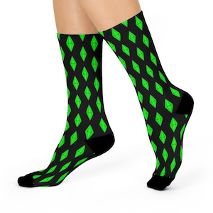 May include: A pair of black socks with a green diamond pattern. The diamonds are the same shape as the logo for the video game The Sims.