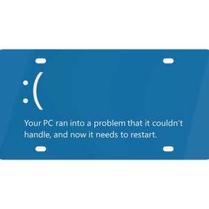 May include: A blue license plate with a white sad face emoticon and the text "Your PC ran into a problem that it couldn't handle, and now it needs to restart."