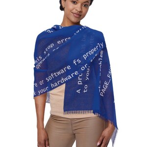 May include: A blue scarf with white text, featuring a fringe at the bottom. The text includes phrases like "This stop error appears" and "PAGE_FAULT". The scarf is draped over the shoulders.