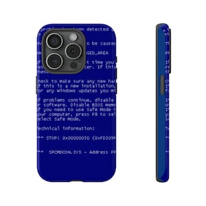 Peut inclure: Une coque de téléphone bleue avec un texte blanc superposé qui dit "Vérifiez que tout nouveau matériel est correctement installé. Si c'est une nouvelle installation, vérifiez s'il existe des mises à jour Windows dont vous pourriez avoir besoin." La coque a un fond bleu avec du texte blanc. La coque a une découpe pour l'appareil photo au dos.