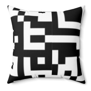 May include: Black and white geometric pattern throw pillow. The pillow features a repeating pattern of squares and rectangles.