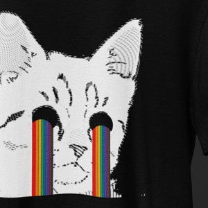 May include: A white cat with black eyes is crying rainbow tears. The cat's face is pixelated, giving it a glitch effect.