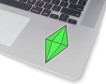 May include: A green diamond-shaped sticker with a black outline on a silver laptop.