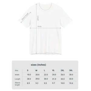 May include: Size chart for a t-shirt in sizes S through 3XL. The chart shows the width, length, and sleeve length in inches.
