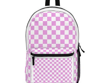 May include: A backpack featuring a repeating light pink and white chequered pattern across the entire exterior. The bag includes a large main compartment, a smaller front zipped pocket, a black top handle, and a black mesh side pocket.