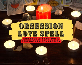 May include: A yellow and red sign with the text "Obsession Love Spell" and "Enhance Attraction & Strengthen Connection". The sign is surrounded by lit candles, tarot cards, and crystals on a dark wooden surface.