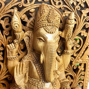 ethnic wooden figurine, Indian handicraft decor, handmade wooden god statue, auspicious home decoration, handcrafted spiritual idol, religious gift for parents, Lord Ganesha sculpture, divine blessing idol, prosperity symbol statue, Diwali puja decor, best pooja room idols, carved wooden ganesha murti, vintage Indian god statue, elephant god idol, wooden deity sculpture, cultural Hindu artwork, sacred altar decoration, divine housewarming present