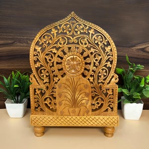 handcrafted festival showpiece, antique style Hindu idol, wooden statue for prayer, artistic wooden murti, spiritual home accessory, wooden carving religious idol, small ganesha idol for temple, handmade pooja gift, Lord Ganpati wooden murti, wooden home temple decor, vastu shastra ganesha idol, carved wooden god sculpture, divine energy showpiece, temple pooja item, auspicious wooden statue, decorative Indian god figurine, sacred spiritual ornament
