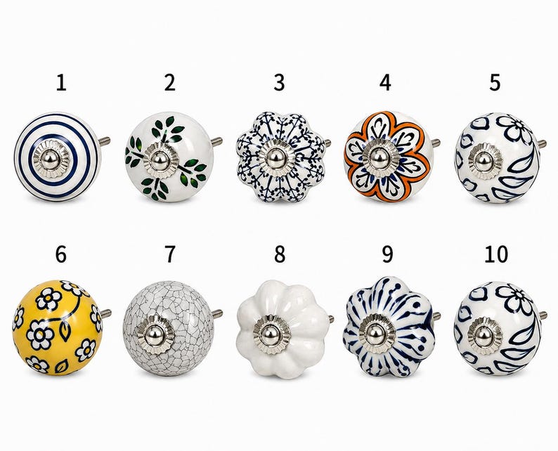 May include: A selection of ten ceramic cabinet knobs with various designs. These include knobs with blue and white stripes, green leaves, and floral patterns. The knobs have a silver metal base and are suitable for cabinets.