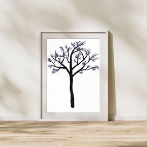 May include: A framed print of a black silhouette of a tree with purple watercolor leaves against a white background.