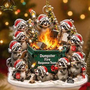 May include: A decorative ornament featuring nine raccoons wearing Santa hats around a green dumpster labeled "Dumpster Fire Response Team". The raccoons are named Harper, Liam, Amelia, Charlotte, Oliver, Sophia, Ethan, Emma, Noah, and James.