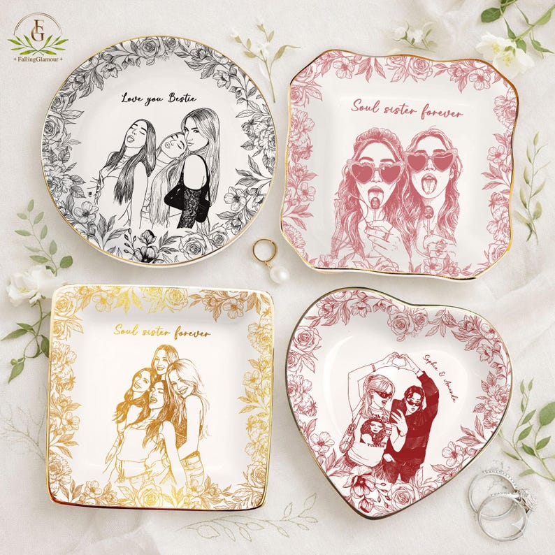 May include: Four decorative plates with floral borders and gold rims. The plates feature illustrations of friends and the phrases "Love you Bestie" and "Soul sister forever". One plate is heart-shaped.