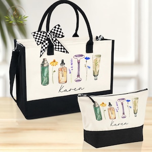 May include: A black and white tote bag and matching cosmetic bag. Both bags have a cream-colored front with a watercolor design of beauty products and flowers. The name "Karen" is written in script. A black and white checkered bow adorns the tote bag.