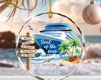 May include: A clear, round ornament with a cruise ship design. The ship is blue and white, with palm trees and the text "Soul of the seas." Includes destination signs and the text "The Anderson Family Nov 17-22, 2025."