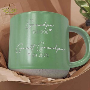 May include: Green ceramic mug with a white inscription that reads "Grandpa Est 1996" and "Great Grandpa Est 2025".