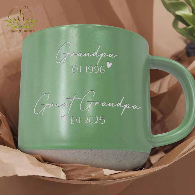 May include: Green ceramic mug with a white inscription that reads "Grandpa Est 1996" and "Great Grandpa Est 2025".