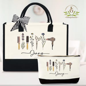 May include: A cream-colored tote bag and matching cosmetic bag with black accents. Both bags feature a design of hairstyling tools and flowers, with the name "Jenny" in script. The tote has a black and white striped bow.