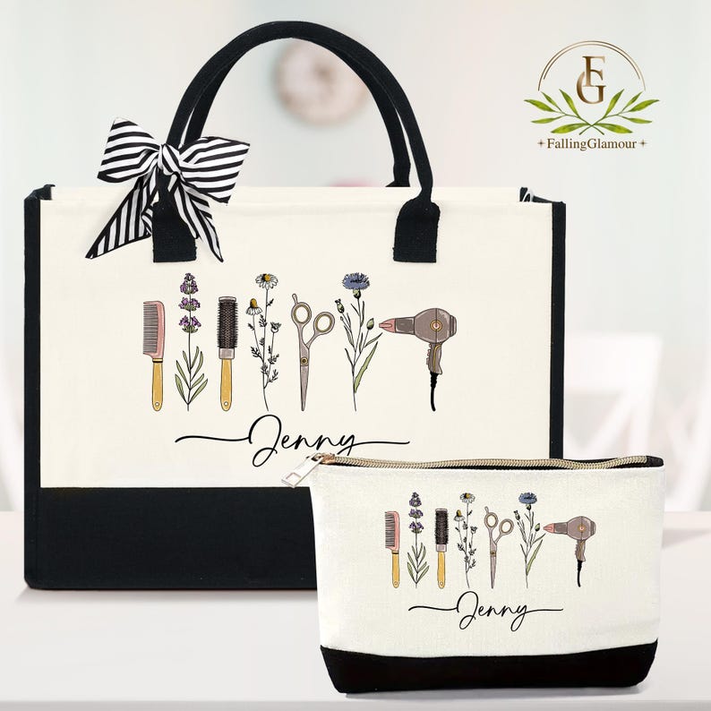 May include: A cream-colored tote bag and matching cosmetic bag with black accents. Both bags feature a design of hairstyling tools and flowers, with the name "Jenny" in script. The tote has a black and white striped bow.