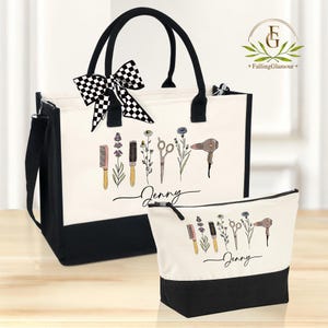 May include: A black and white tote bag and matching cosmetic bag. The bags have a cream-colored center with a black bottom and handles. The bags are decorated with illustrations of salon tools and flowers, with the name "Jenny" written in cursive.