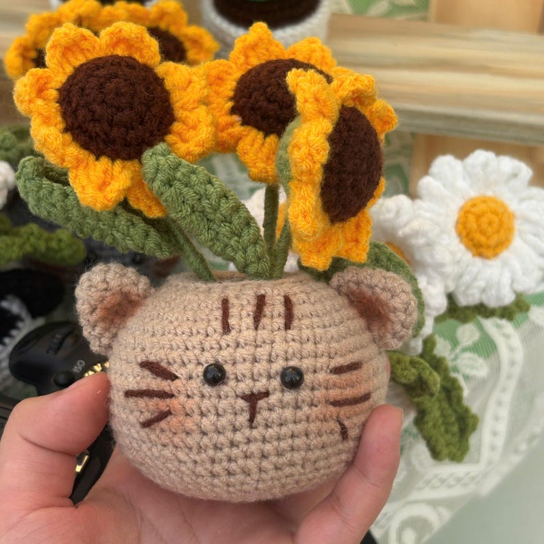 Kawaii cat plush planter with white daisy flowers, perfect gift for cat lovers