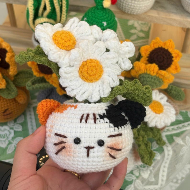 Crochet flower pot with cat face design, handmade yarn decor for office
