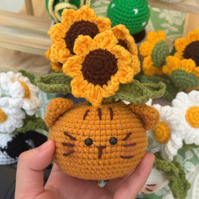 Cute cat planter with daisy bouquet, soft yarn decor for shelf or dashboard