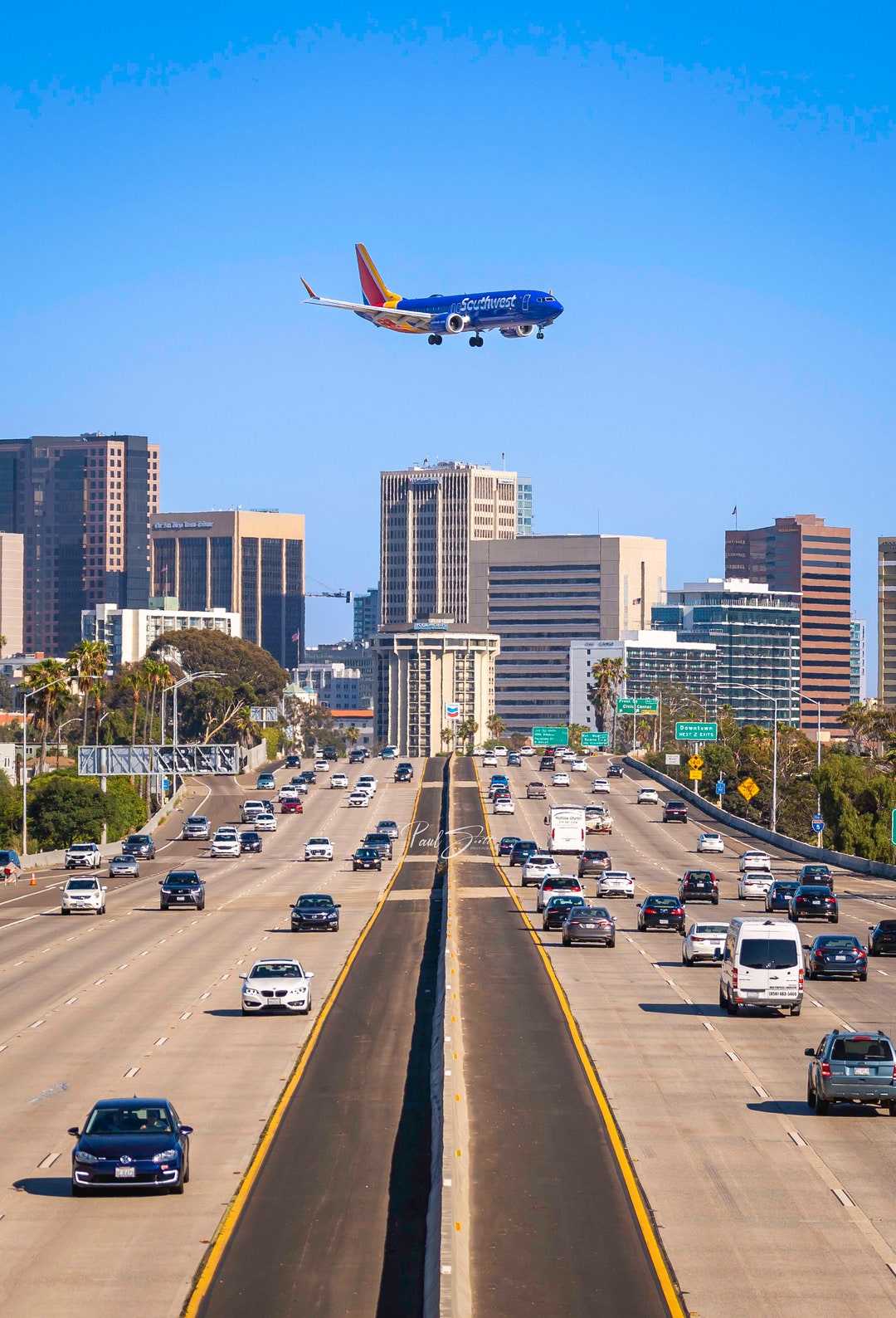 737 Flying Over San Diego Cityscape and I5 Vertical Wall Picture high