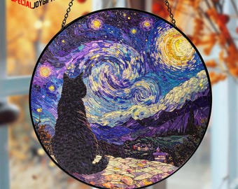 May include: Round stained glass window art featuring a black cat gazing at a swirling night sky with stars and a crescent moon. The artwork has a black metal frame and is suspended by a chain. The text "SPECIALJOYGIFTS" is in the upper left corner.