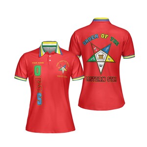 May include: Red polo shirt with the text "OES" in green, blue, and yellow. The shirt has a collar with yellow, green, and blue stripes. The back of the shirt displays the words "Order of the Eastern Star" and a star emblem.