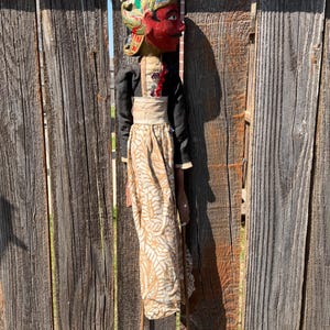 May include: A rustic wooden sign with the text "Welcome to our home" in white lettering. The sign features a distressed finish and a simple, inviting design, perfect for entryway decor.