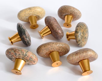 Handles pulls and knobs. Kitchen handles for dressers, cupboards and cabinets. Rock door knobs for dressers. Sea stone gold handles
