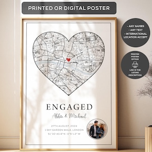 May include: A vertical rectangular poster featuring a black and white street map shaped like a heart with a small red heart icon in the centre. Below the map, the text reads ENGAGED, Abbie & Michael, 27TH AUGUST, 2024, 1 SKY GARDEN WALK, LONDON, 51°30'40.6"N - 0°5'1.2"W, and a circular photo of a couple.