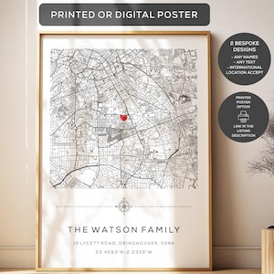 May include: A framed map poster featuring a black and white street grid with a red heart icon marking a specific location. The text reads THE WATSON FAMILY, 12 LYCETT ROAD, DRINGHOUSES, YORK, and 53.4593°N -2.2335°W, with a compass rose symbol.