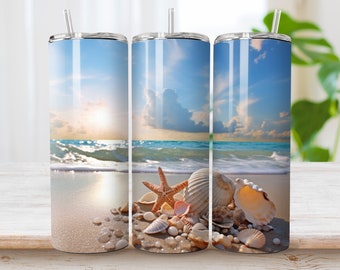 May include: A stainless steel tumbler with a beach scene and seashells. The tumbler has a blue sky, white clouds, and a blue ocean with white waves. The beach is sandy and there are seashells and a starfish on the sand.