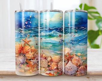 May include: Three stainless steel tumblers with a beach scene design. The tumblers feature a watercolor-style painting of ocean waves, seashells, and a starfish. The tumblers are a light blue, turquoise, and white color.