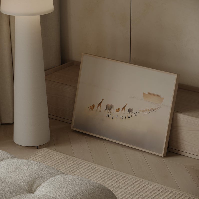 May include: A framed art print depicts a procession of animals, including lions, giraffes, and elephants, walking towards a boat. The artwork has a soft, muted color palette with a light brown wooden frame.