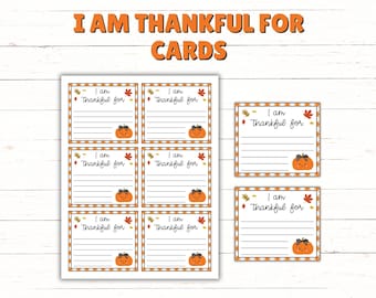 May include: Thanksgiving-themed cards with the text "I AM THANKFUL FOR CARDS." The cards feature a pumpkin illustration and space for writing. The design includes fall leaves and a decorative border.