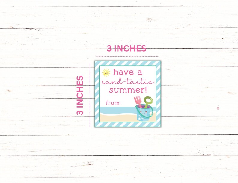 May include: A 3x3 inch blue and white striped tag with a yellow sun, pink text that says "have a sand-tastic summer!" and a bucket with beach toys. The tag says "from:" at the bottom.