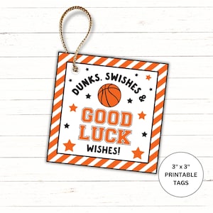 May include: A square printable tag with a basketball theme. The tag has an orange and white striped border and features the words "DUNKS, SWISHES & GOOD LUCK WISHES!" with a basketball graphic. The tag is 3 inches by 3 inches.