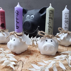 Lucky pig candle holder, candlestick made of Raysin, lucky pig with candle