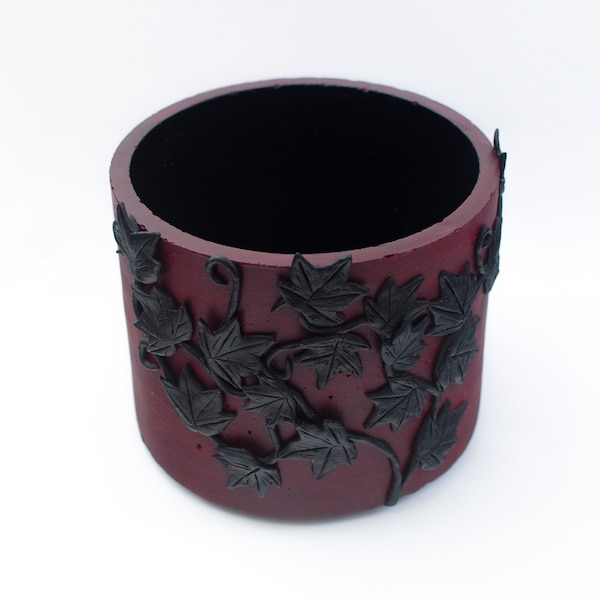 13cm Handmade concrete indoor red plant pot with moulded, handpainted black ivy design