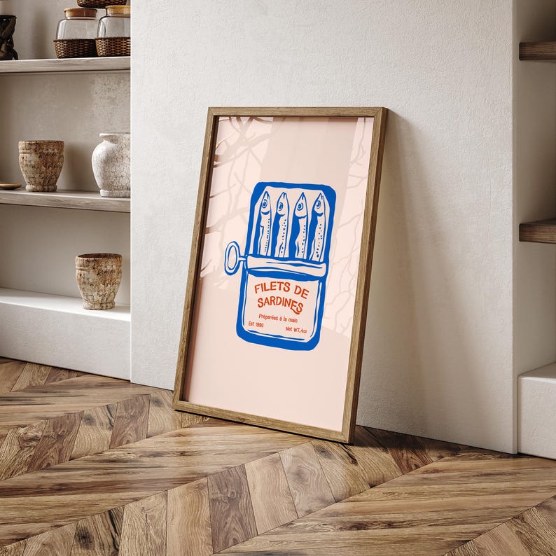 a picture frame sitting on the floor next to a shelf