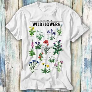 May include: White t-shirt with a graphic of various British wildflowers and the text "BRITISH WILDFLOWERS".